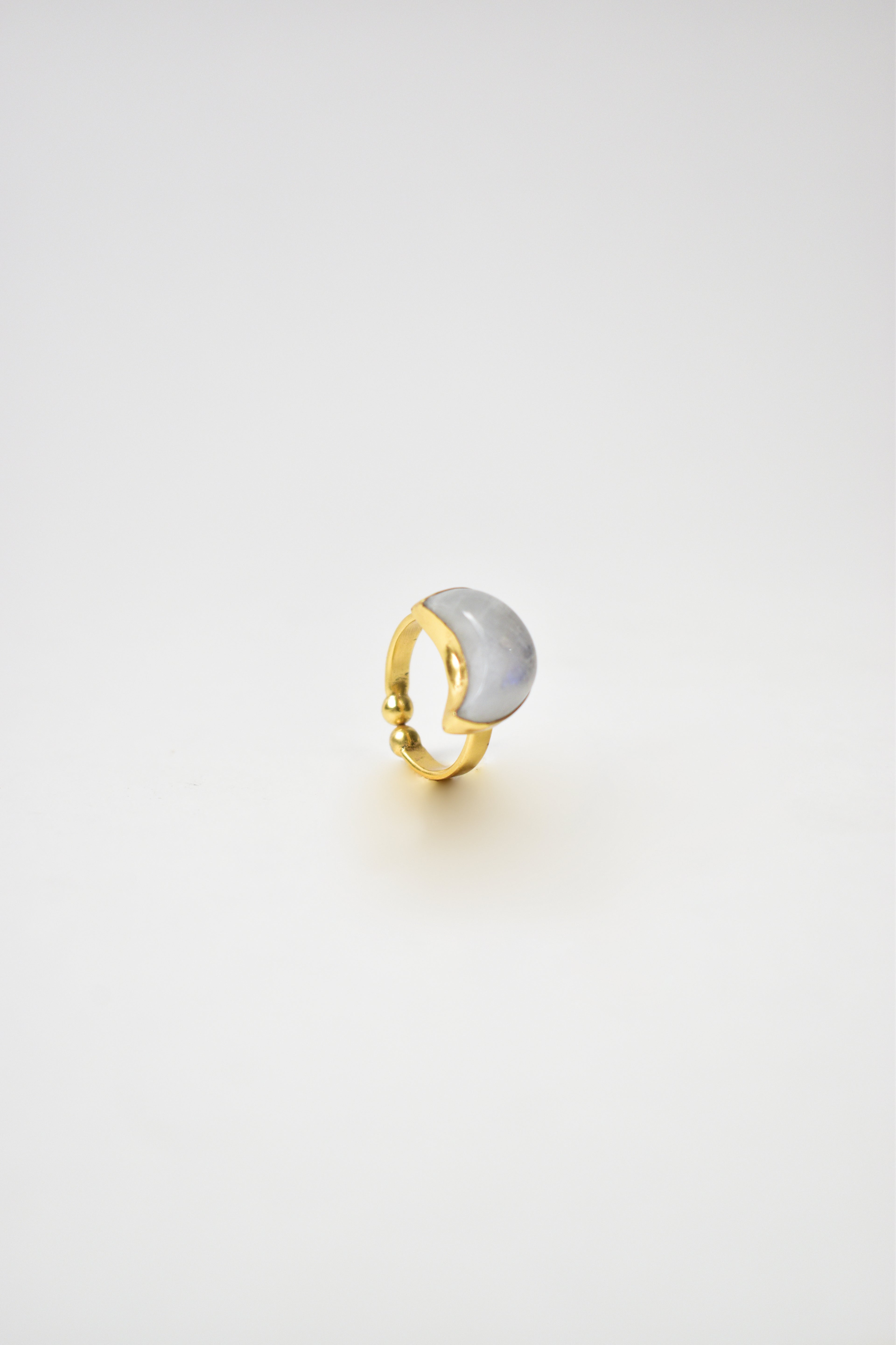 Gold and silver ring on a light gray background Kokum jewels